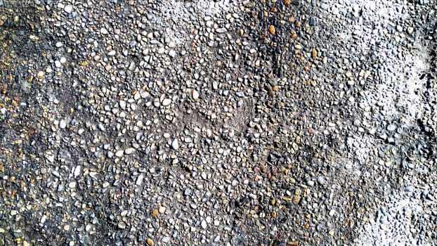 the old asphalt is gray, black in color, the texture is made of asphalt. Gray texture of the road covered with asphalt