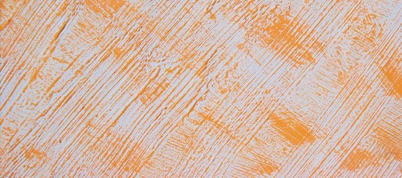 Orange pattern on a white wall. Orange abstract background with stripes and spots. Bright texture for banner or poster