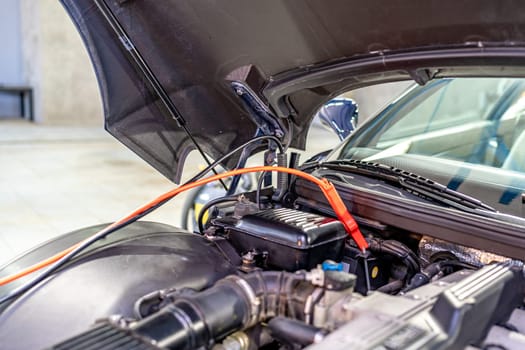 starting the car engine using the starter cable.