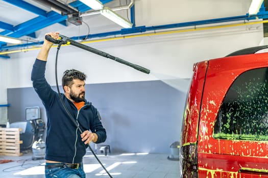 wash cars with green active foam in the garage. High quality photo