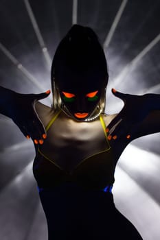Image of silhouette of slender girl with UV makeup, close-up