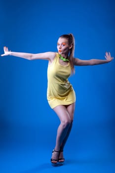 Emotional young girl posing with bright neon makeup