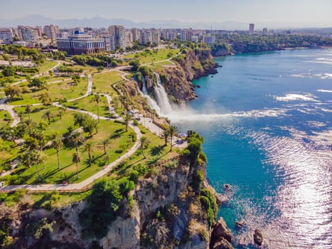 Lower Duden Falls drop off a rocky cliff falling from about 40 m into the Mediterranean Sea in amazing water clouds. Tourism and travel destination photo in Antalya, Turkey. Turkiye