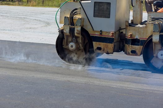 It is process of asphalting road by using asphalt special machines that use heavy vibrating rollers.