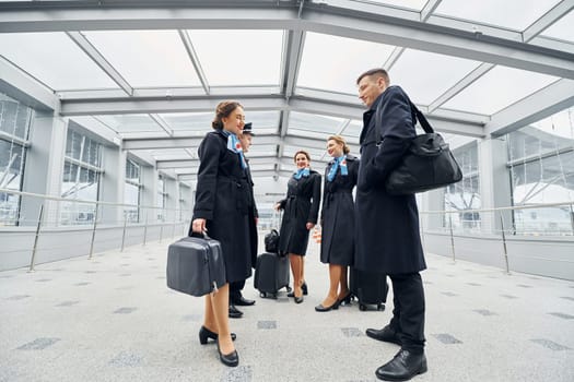 Airplane crew in uniform is going to the work together.