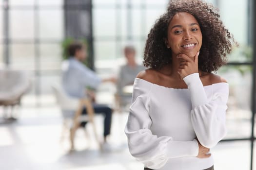 Portrait of an African American young business woman working in the office.