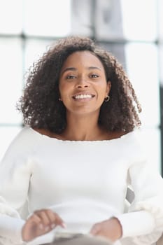 Portrait of a young attractive African American woman using a smartphone.