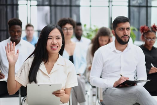conducts business training with a group of young people.