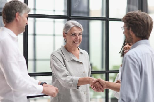 Conversation between managers and employees in the office.