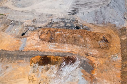 Quarry for mining of natural resources on the hill, aerial view
