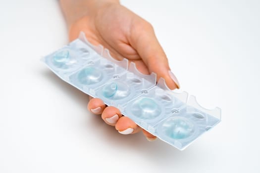 Package of contact lenses in woman hands for improvement of eyesight