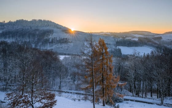 Panoramic image of winter landscape during sunrise, Schmallenberg, Sauerland, Germany