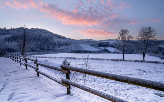 Panoramic image of winter landscape during sunrise, Schmallenberg, Sauerland, Germany