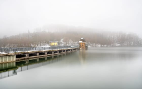 Panoramic image of Lister lake on a foggy winter day, Sauerland, Germany