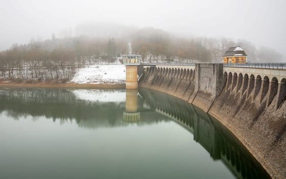 Panoramic image of Lister lake on a foggy winter day, Sauerland, Germany