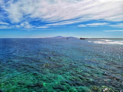 Seascape with emerald water. Group of islands in the ocean. Bright sunny day. clear azure ocean water background