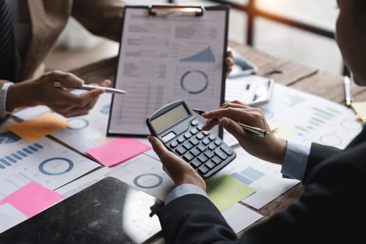 Financial Business meeting analyze tax graph calculator company's performance to create profits and growth, Market research reports and income statistics, Financial and Accounting concept.
