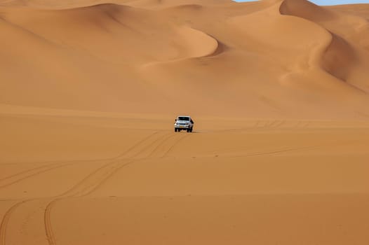 off road with a 4x4 vehicle in the dunes of the Libyan sahara desert