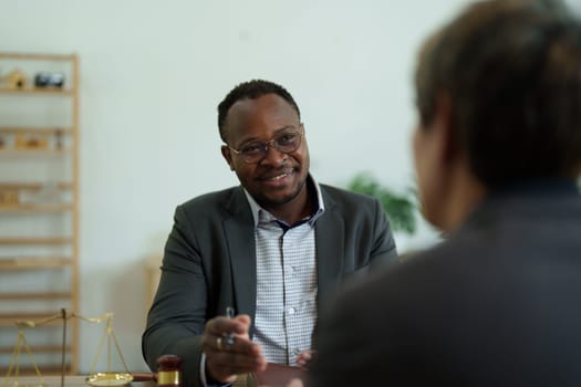 african american attorney, lawyers discussing contract or business agreement at law firm office, Business people making deal document legal, justice advice service concepts.