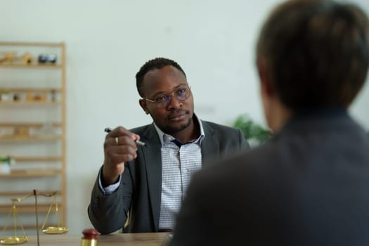 african american attorney, lawyers discussing contract or business agreement at law firm office, Business people making deal document legal, justice advice service concepts.