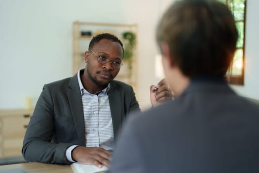 african american attorney, lawyers discussing contract or business agreement at law firm office, Business people making deal document legal, justice advice service concepts.