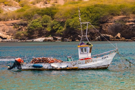 A fishing boat with a distinctive cockpit and nets off the coast of Cape Verde Islands, Atlantic Ocean, Africa
