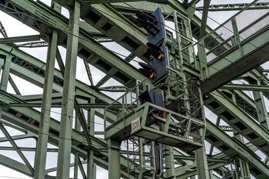 traffic lights for trains on the metal bridge of the railway line. High quality photo