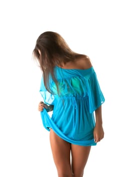 Portrait of charming brunette shows blue sundress, close-up