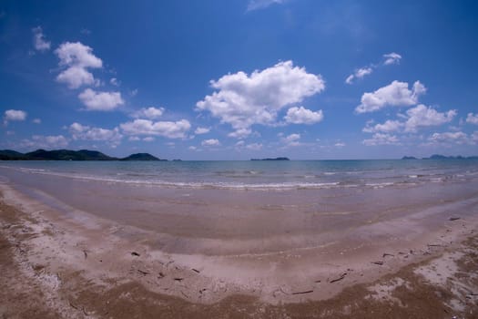 Daytime beach wide angle. Sairee Beach, March 2019. Fluffy white clouds and blue skies.