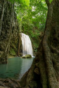 Clean green emerald water from the waterfall Surrounded by small trees - large trees,  green colour, Erawan waterfall, Kanchanaburi province, Thailand