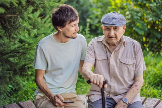 Grandfather and adult grandson spend time together in the park.