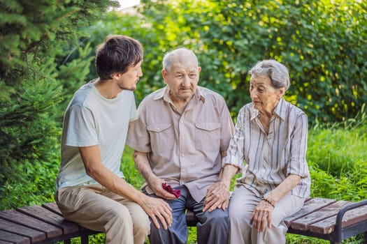 Grandmother, grandfather and their adult grandson spend time together in the park. Elderly couple. Senior husband and wife holding hands and bonding with true emotions.