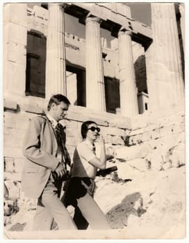 THE ACROPOLIS OF ATHEN, GREECE - NOVEMBER 19, 1972: Vintage photo shows tourists on holidays - vacation. Retro black and white photography. Circa 1970.