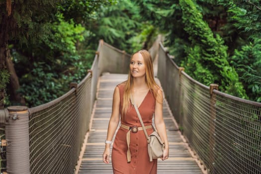 Woman tourist in Rope bridge in Yildiz Park. Besiktas, Istanbul, Turkey. Turkiye.