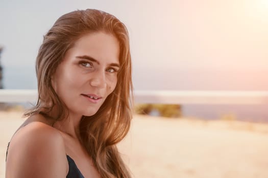 Happy woman portrait in cafe. Boho chic fashion style. Outdoor photo of young happy woman with long hair, sunny weather outdoors sitting in modern cafe