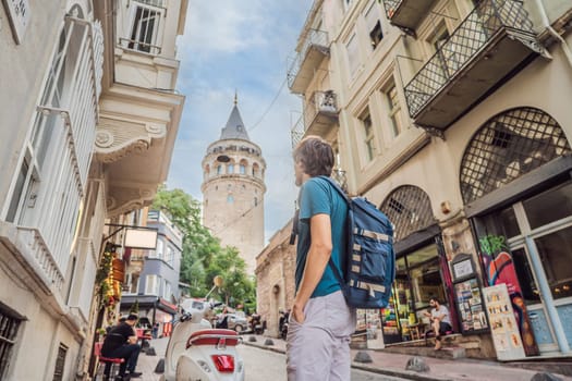 Portrait of man tourist with view of Galata tower in Beyoglu, Istanbul, Turkey. Turkiye.