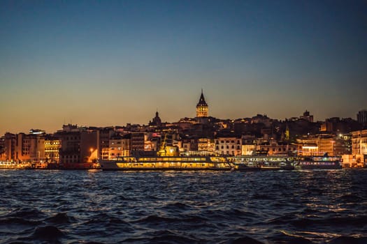 Istanbul city skyline in Turkey, Beyoglu district old houses with Galata tower on top, view from the Golden Horn.