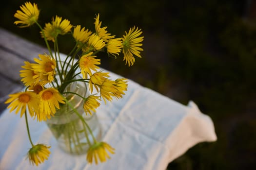 top view of a bouquet of yellow flowers standing on the street. High quality photo