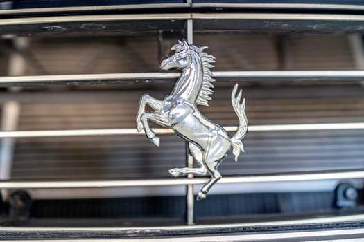Olomouc, Czech - February 28,2023: ferrari symbol on the front fascia of the car.
