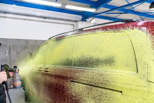 wash cars with green active foam in the garage. High quality photo