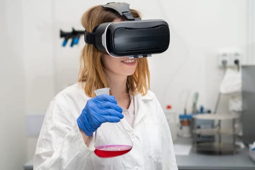 Scientist in VR googles, lab coat and rubber gloves manages the virtual interface. Digital technology NFT game and entertainment