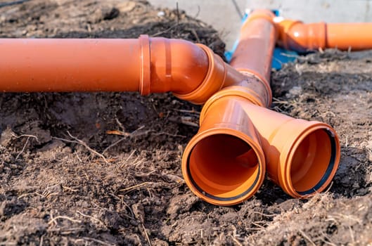 PVC plastic pipe for sewerage in the ground.