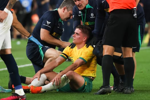 MELBOURNE, AUSTRALIA - MARCH 28: Cameron Devlin of Australia has a cut to the head during an international friendly match between the Australia Socceroos and Ecuador at Marvel Stadium on March 28, 2023 in Melbourne, Australia.
