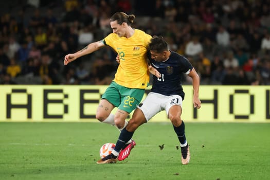 MELBOURNE, AUSTRALIA - MARCH 28: Jackson Irvine of Australia battles with Alan Franco of Ecuador during an international friendly match between the Australia Socceroos and Ecuador at Marvel Stadium on March 28, 2023 in Melbourne, Australia.