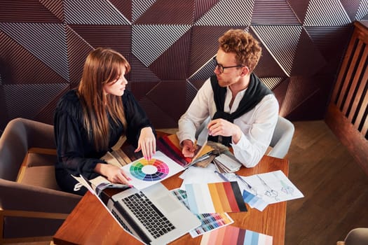 Business people working with documents. Indoors of new modern luxury restaurant.