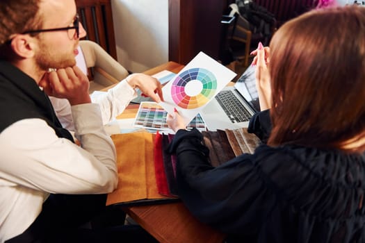 Business people working with documents. Indoors of new modern luxury restaurant.