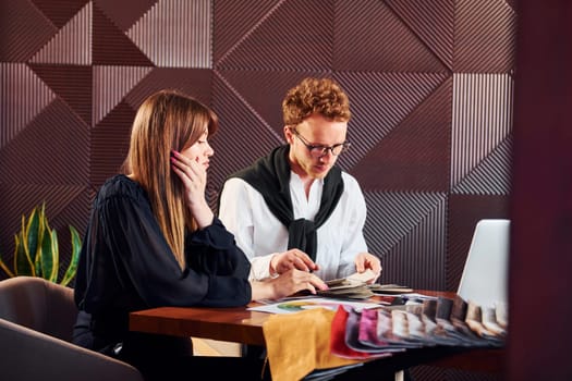 Business people working with documents. Indoors of new modern luxury restaurant.