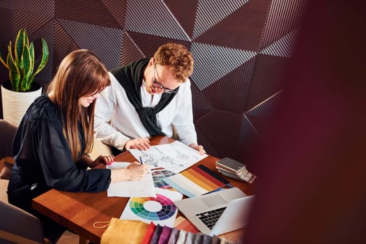 Business people working with documents. Indoors of new modern luxury restaurant.