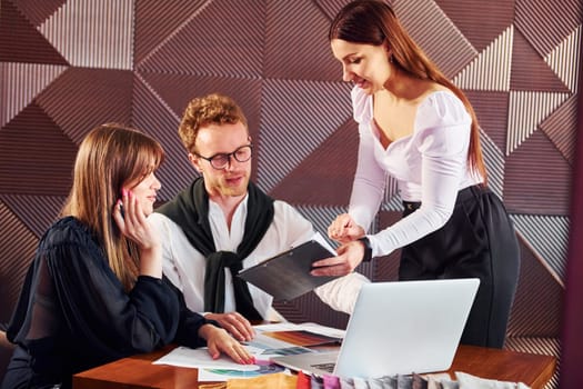 Business people working with documents. Indoors of new modern luxury restaurant.