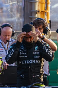 MELBOURNE, AUSTRALIA - APRIL 2: Lewis Hamilton of Great Britain of Mercedes AMG Petronas F1 Team prepares to get into his car at a restart on race day during the 2023 Australian Grand Prix on April 2, 2023 in Melbourne, Australia.